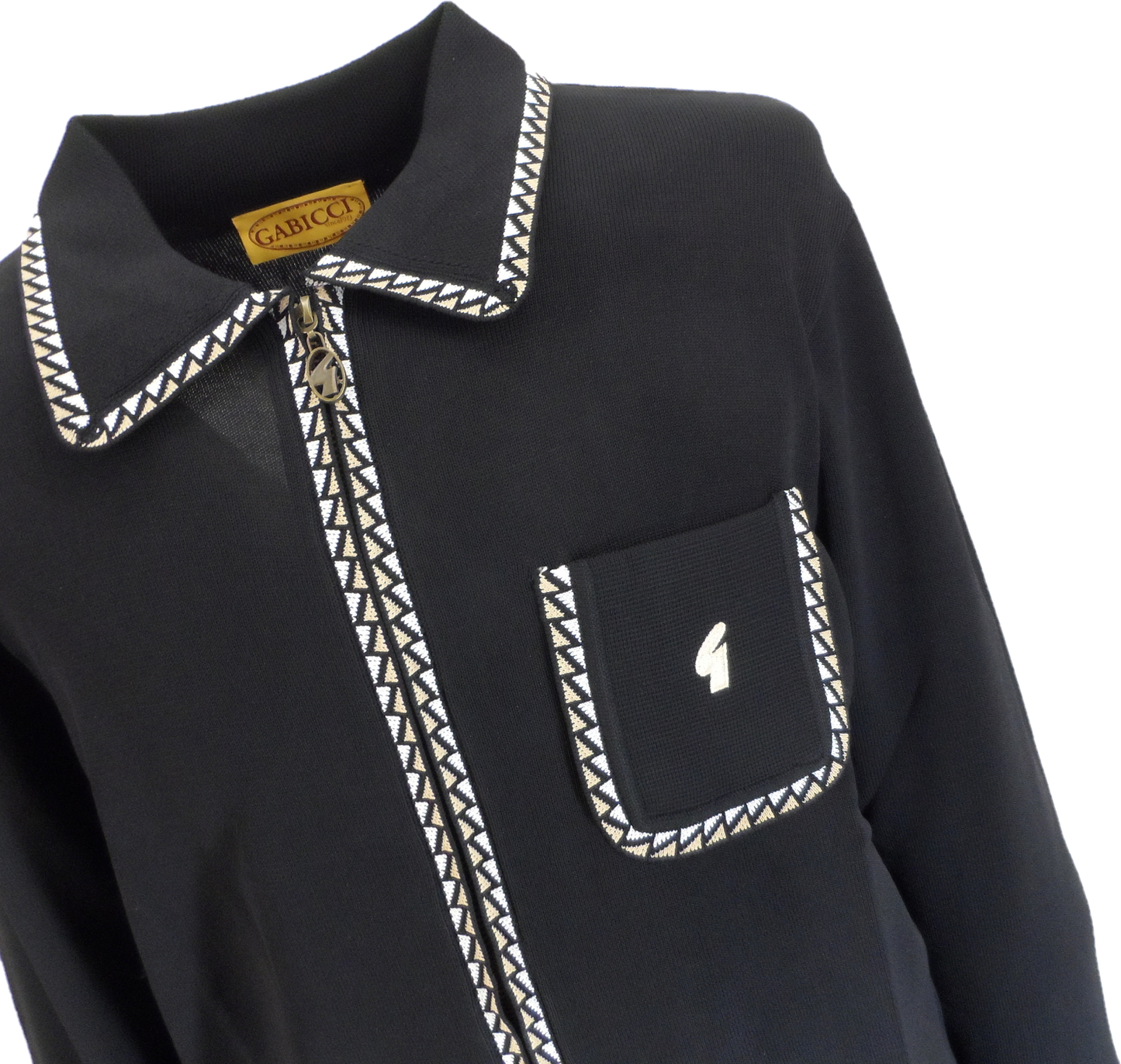 A close-up of a black long-sleeve collared shirt by GariccI, featuring a pointed collar and chest pocket trimmed with a white and black geometric pattern, and a small white logo on the pocket.
