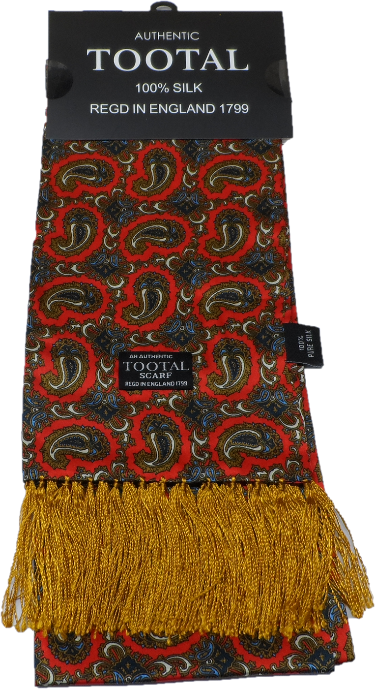 A Tootal silk scarf with a red, black, and gold paisley pattern and a gold fringe, shown with its black cardboard header card.