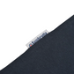 Close-up of a dark navy blue knit fabric with a small white brand tag reading Ambreta.