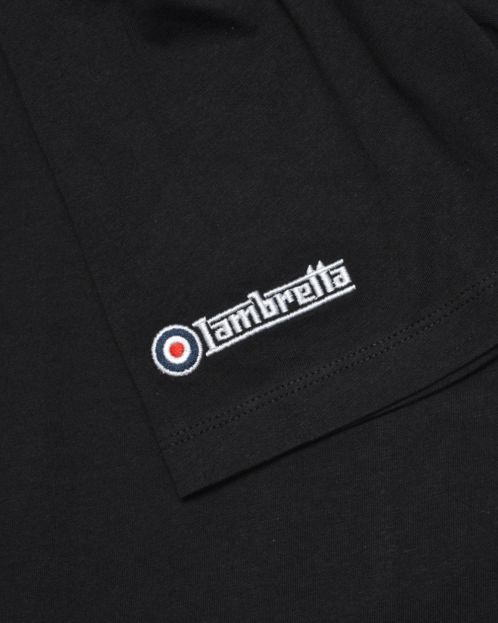 Black fabric with a Lambretta logo embroidered on it