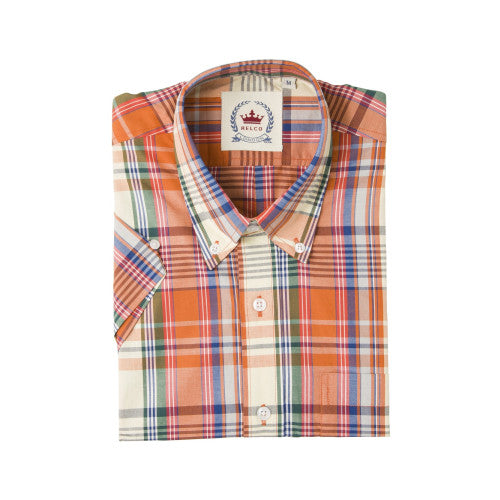 Folded plaid shirt with a brand label on a white background