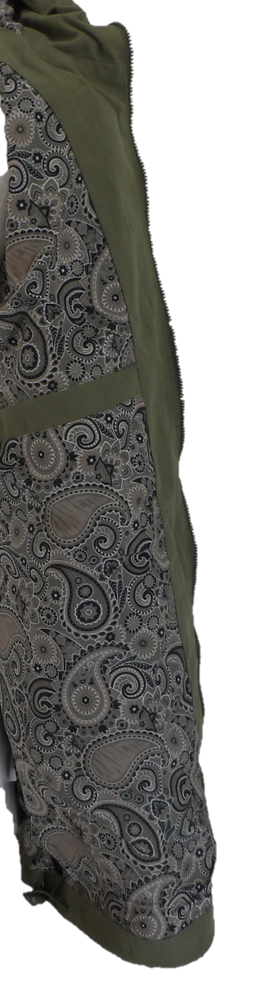 Close-up of a garment featuring an olive green fabric body with a large gray paisley patterned panel, shown against a plain white background.
