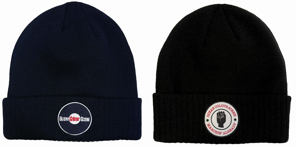 Two knit beanie hats shown side by side on a plain white background. The left beanie is dark navy blue with a circular white logo patch on the front cuff.