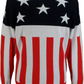 A long-sleeve knit sweater featuring an American flag design, with a black upper section containing white stars and a lower section with red and white vertical stripes.