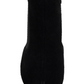 Black sock boot on a white background