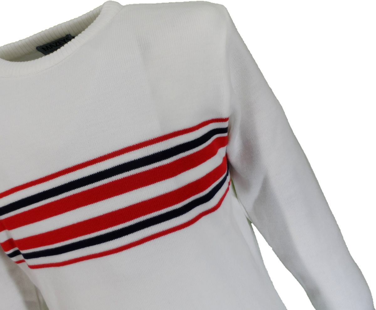 A close-up of a white knit sweater featuring a horizontal striped pattern across the chest in red, navy, and white.