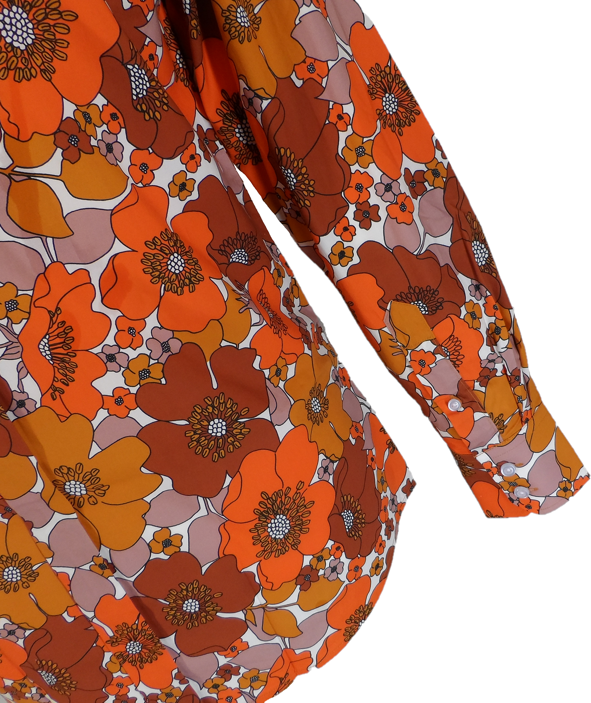 A close-up of a long-sleeve blouse featuring a bold 1970s floral pattern in orange, rust brown, mustard yellow, and dusty pink on a white background.