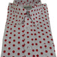 A white long-sleeve button-down shirt with red polka dots, folded neatly to show the collar, front buttons, and a chest pocket. The brand label 'MAZEYS' is visible inside the collar.