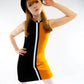 Woman wearing a black, orange, and white dress with a hat on a white background