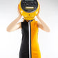 Person wearing a black and yellow dress with a large round object on their head against a white background