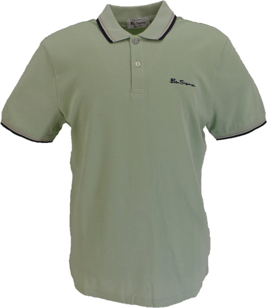 Light green polo shirt with black trim on a white background
